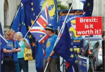  ?? AP PHOTO ?? Anti-Brexit supporters stage a protest in front of the Houses of Parliament in London on Tuesday.