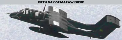  ?? —REUTERS ?? An Air Force OV-10 bomber prepares to drop bombs on insurgents from the Maute group in Marawi City.