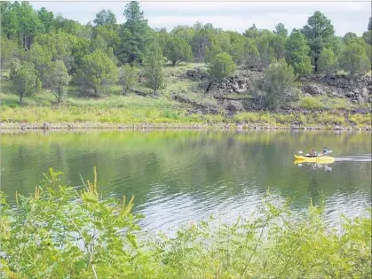  ?? Molly Hottle ?? FOOL HOLLOW Lake Recreation Area near Show Low, Ariz., draws outdoor enthusiast­s and escapees from hotter weather.