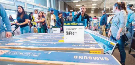  ?? — Reuters ?? Consumers shop Black Friday sales at the Best Buy store in Burbank, California.