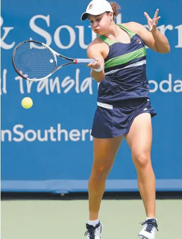  ?? Picture: AP ?? Ash Barty returns to Venus Williams during their match at the Western & Southern Open.