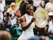  ?? Ben Curtis / Associated Press ?? Serena Williams holds her trophy after winning the 2016 Wimbledon final against Angelique Kerber.