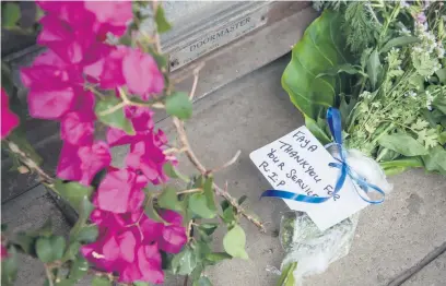  ?? Picture: Michel Bega ?? WHO IS NEXT? Flowers outside Newclare Pharmacy yesterday, after pharmacist Faizel McKenzie was shot dead outside his business on Monday. The killing was not linked to a robbery.