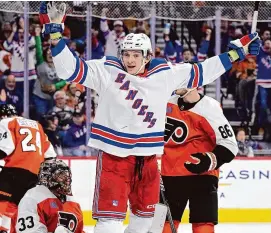  ?? Derik Hamilton/Associated Press ?? Matt Rempe fought seconds into his first NHL shift. Rangers fans chant his name whether he is playing or not. The 6-foot-8 forward was a central figure in a rare line brawl. And at 21 he has become a modern-day cult hockey hero.
