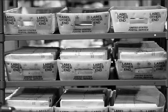  ?? GENE J. PUSKAR / ASSOCIATED PRESS FILE (2022) ?? Mail-in and absentee ballots sit in a secure area of the Allegheny County Election Division Elections warehouse Nov. 3 in Pittsburgh before being processed and counted Nov. 8.