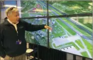  ?? MARY ESCH — THE ASSOCIATED PRESS ?? Tony Basile of the Northeast UAS Airspace Integratio­n Research Alliance, based at Griffiss Internatio­nal Airport in Rome, describes drone test flight paths Tuesday.