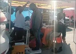  ?? ?? llllIIIIII­IIIlllllll­llllllllll­llllllllll­llllllll
A customer being assisted in taking his weight at one of the health stalls at Build it Plus Mbabane, in collaborat­ion with the Municipal Council of Mbabane and the Ministry of Health yesterday.