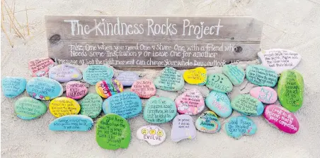  ??  ?? A garden of painted rocks at Sandy Neck Beach in Barnstable, Massachuse­tts, part of The Kindness Rocks Project.