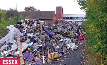  ??  ?? ESSEX Karen Young blames tough restrictio­ns at a recycling centre in the county town of Chelmsford for these hills of rubble blocking an office building’s driveway