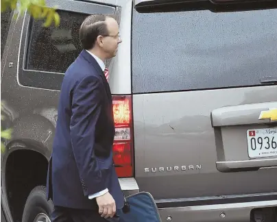  ?? AP PHOTOS ?? GLOOM LOOMS: Deputy Attorney General Rod Rosenstein, seen above leaving the White House yesterday, will meet Thursday with President Trump, below, to discuss his future.