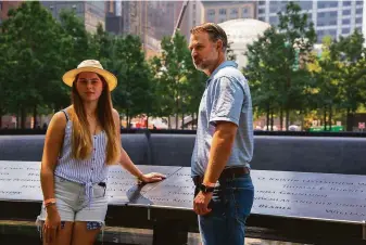  ?? Calla Kessler / Special to The Chronicle ?? John Beaven and his daughter Sara, 16, stand where his father’s name is engraved at the 9/11 Memorial in Manhattan. Alan Beaven died when Flight 93 was brought down in Pennsylvan­ia.