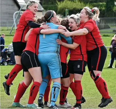  ?? Picture: Brian Rossiter ?? Michelle Watson, left, joins the celebratio­ns after Dursley’s penalty shoot-out semi-final victory over Red Falcon