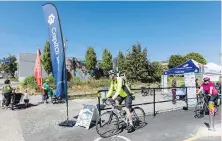  ?? DARREN STONE, TIMES COLONIST ?? A celebratio­n station at Esquimalt Road and Mary Street as part of Go By Bike Week.