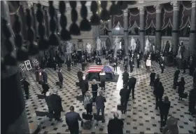  ?? GREG NASH - POOL, THE HILL ?? People stand during a ceremony to honor Justice Ruth Bader Ginsburg as she lies in state at National Statuary Hall in the U.S. Capitol on Friday.