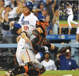  ?? (Reuters) ?? LOS ANGELES DODGERS baserunner Justin Turner (10) scores the game-winning run past San Francisco Giants catcher Buster Posey on a double by Kyle Farmer (inset) – in his first major league at-bat – in the 11th inning of the Dodgers’ 3-2 home win over...