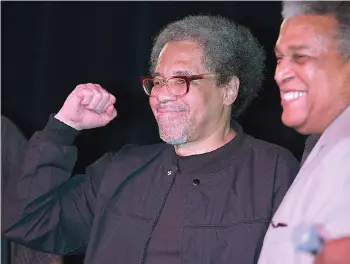  ?? The Associated Press ?? ■ Albert Woodfox, left, pumps his fist as he arrives on stage with Parnell Herbert during his first public appearance Feb. 19, 2016, at the Ashe Cultural Arts Center in New Orleans after his release from Louisiana State Penitentia­ry in Angola, La., earlier in the day. Woodfox, who was the last of three high-profile Louisiana prisoners known as the “Angola Three” to be released, died Thursday of complicati­ons from COVID-19, according to a statement from his family. He was 75.