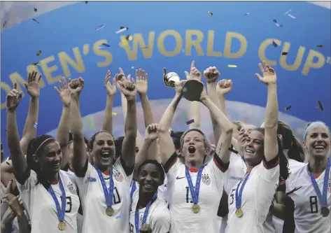  ?? AP PHOTO/ALESSANDRA TARANTINO, FILE ?? United States’ Megan Rapinoe lifts up the trophy after winning the Women’s World Cup final soccer match between US and The Netherland­s at the Stade de Lyon in Decines, outside Lyon, France, in 2019.