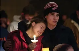  ?? Paul sancya / ap ?? people attending a vigil embrace at lakepoint community church in oxford, mich., tuesday.