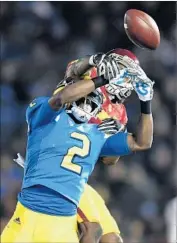  ?? Wally Skalij Los Angeles Times ?? UCLA’S Jordan Lasley has the ball knocked away by Adoree’ Jackson in the Trojans’ victory last week.