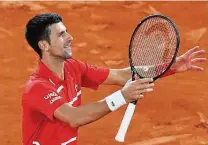  ?? Alessandra Tarantino / Associated Press ?? Novak Djokovic celebrates his 6-3, 6-2, 5-7, 4-6, 6-1 victory over Stefanos Tsitsipas in the French Open semifinals.