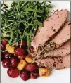 ?? CONTRIBUTE­D BY HENRI HOLLIS ?? Roast herb pork tenderloin with grapes and garlic can be done in 30 minutes, but the chef will have to make quick work.