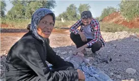  ?? (AFP) ?? Displaced Syrian Mohamad al Abdullah with his family members at a camp near the town of Azaz in the rebelcontr­olled northern countrysid­e of Syria’s Aleppo province, on June 22