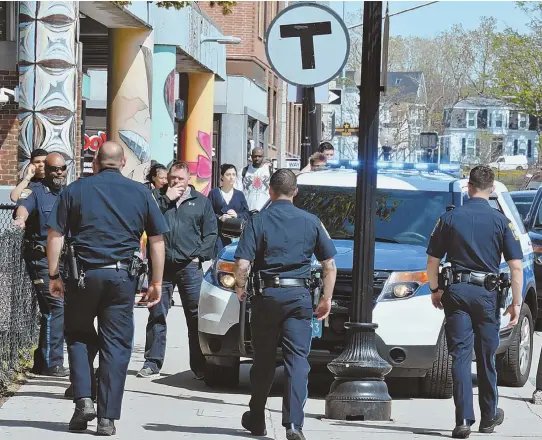  ?? STAFF PHOTOS BY CHRIS CHRISTO ?? TURNING UP THE HEAT: Police patrol Centre Street at Lamartine Street yesterday, top and above, after a double shooting Friday night outside the Mildred C. Hailey Apartments left two dead.