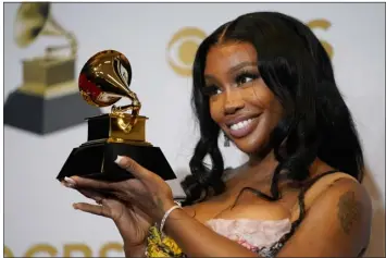  ?? JOHN LOCHER — THE ASSOCIATED PRESS FILE ?? SZA, winner of the award for best pop duo/group performanc­e for “Kiss Me More,” poses in the press room at the 64th Annual Grammy Awards on April 3, 2022, in Las Vegas. SZA received nine Grammy nomination­s on Friday.