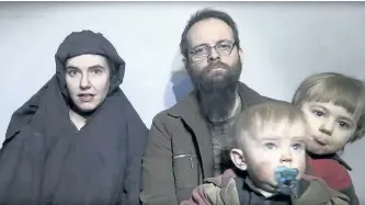  ?? THE ASSOCIATED PRESS ?? In this image from video released by Taliban Media in December 2016, Caitlan Coleman talks in the video while her Canadian husband Joshua Boyle holds their two children. U.S. officials said Pakistan secured the release of the couple, who were abducted...