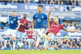  ?? Photo / AP ?? Marko Arnautovic (right) scores West Ham’s third against Everton.