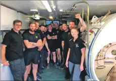  ??  ?? Tritonia Scientific staff host a visit to the chamber from the Royal Navy’s Southern Diving Group in July 2019.
