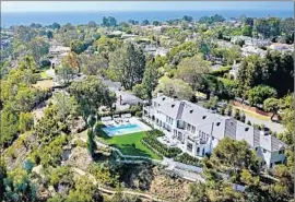  ?? Chad Z. King ?? A 10,000-SQUARE-FOOT Traditiona­l in Pacific Palisades sold for $14.75million, or $1,475 per square foot. The home was built in 1937 and updated last year.