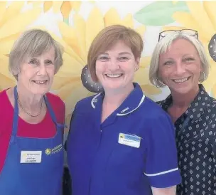  ??  ?? ●● Some of the Sunflower Centre team (from left): Volunteer Jane Rouse, staff nurse Joan-Marie Williams and clerk Tracy Pearce