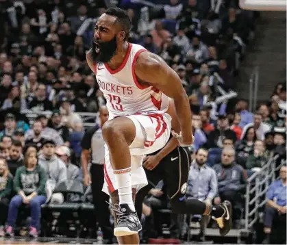 ?? Morry Gash / Associated Press ?? Despite the visit to Milwaukee being the second part of a back-to-back, James Harden has a burst of energy Wednesday. Harden’s most impressive stretch in his 26-point night was a run of 11 points in the final 2½ minutes of the first half.