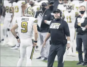  ?? ISAAC BREKKEN - FREELANCER, AP ?? New Orleans Saints head coach Sean Payton, right, speak with quarterbac­k Drew Brees (9) during the first half of an NFL football game, Monday, Sept. 21, 2020, in Las Vegas.