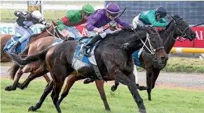  ??  ?? Platinum Command claims the Winter Cup spoils at Riccarton on Saturday.