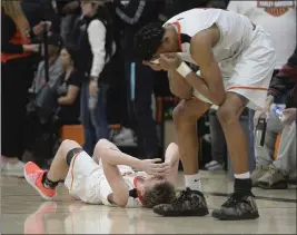  ?? JOEL ROSENBAUM — THE REPORTER ?? Vacaville High’s Brayden Kamman (left) and MJ Amey react as their teammates’ lastsecond attempts to tie their game against Will C. Wood failed as time ran out.