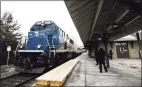  ?? Christian Abraham / Hearst Connecticu­t Media file photo ?? A Metro-North train pulls into the Derby-Shelton station in 2018.