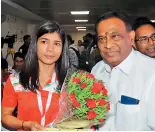  ?? ?? Sports Authority of Telangana State chairman Allipuram Venkateshw­ar Reddy (right) greets world boxing champion Nikhat Zareen on her arrival in New Delhi on Tuesday.