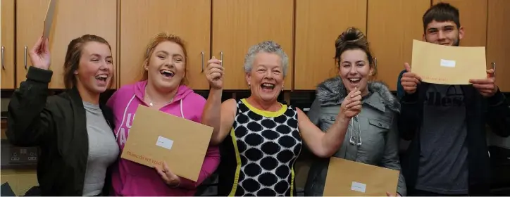  ??  ?? Alyshia Jackson, Jade Sheehy, Oshea Lawlor and Marc Gallagher celebrate their leaving cert results Deputy Principal Margaret Deegan at O’Fiaich college