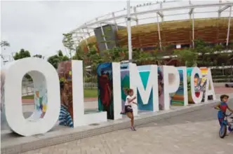  ?? — AP ?? RIO DE JANEIRO: Children play near the Olympic Park sign in Rio de Janeiro, Brazil.