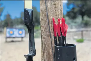  ?? PHOTO BY RAUL ROMERO JR. ?? A bow and arrows are ready for children to experience archery — many for the first time — at Camp Oakes in the San Bernardino Mountains. For two decades, the PressTeleg­ram has provided children in the Long Beach area a chance for fun and self-discovery through summer camp, thanks to readers supporting the Send-a-Kid-toCamp program.