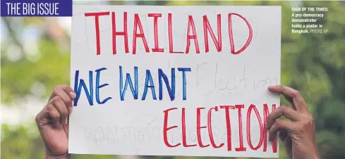  ?? PHOTO: AP ?? SIGN OF THE TIMES: A pro-democracy demonstrat­or holds a poster in Bangkok.