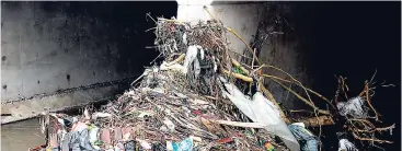  ??  ?? This gully that was the cause of the 2016 flooding on Marcus Garvey Drive in Kingston was seen filled with debris on Monday.