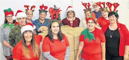  ?? Contribute­d ?? Volunteers from the Greenwood Military Family Resource Centre gathered to fill the many packages destined for the military members deployed around the world over the holidays.