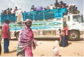  ?? AP ?? People board a truck June 19, 2023, as they leave Khartoum, Sudan. The country has been torn by war between Sudan’s military and the paramilita­ry Rapid Support Forces.