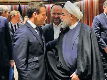  ?? AFP ?? Iranian President Hassan Rouhani (R) speaks with his French counterpar­t, Emmanuel Macron, at the United Nations headquarte­rs in New York, US, on September 23, 2019.