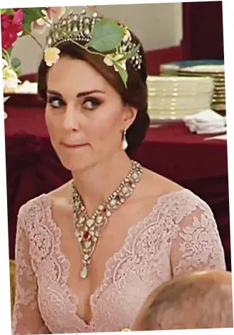  ??  ?? Taking the plunge: Kate in a pale pink gown and Diana’s tiara