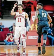  ?? OKLAHOMAN] [PHOTO BY BRYAN TERRY, THE ?? Oklahoma freshman point guard Trae Young, left, is averaging 37.7 points, 8.3 assists and 6.3 rebounds in the Sooners’ last three home games.