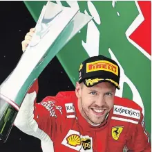  ?? MARK THOMPSON GETTY IMAGES ?? Sebastian Vettel of Germany and Ferrari celebrates on the podium after the Canadian Formula One Grand Prix at Circuit Gilles Villeneuve in Montreal on Sunday.